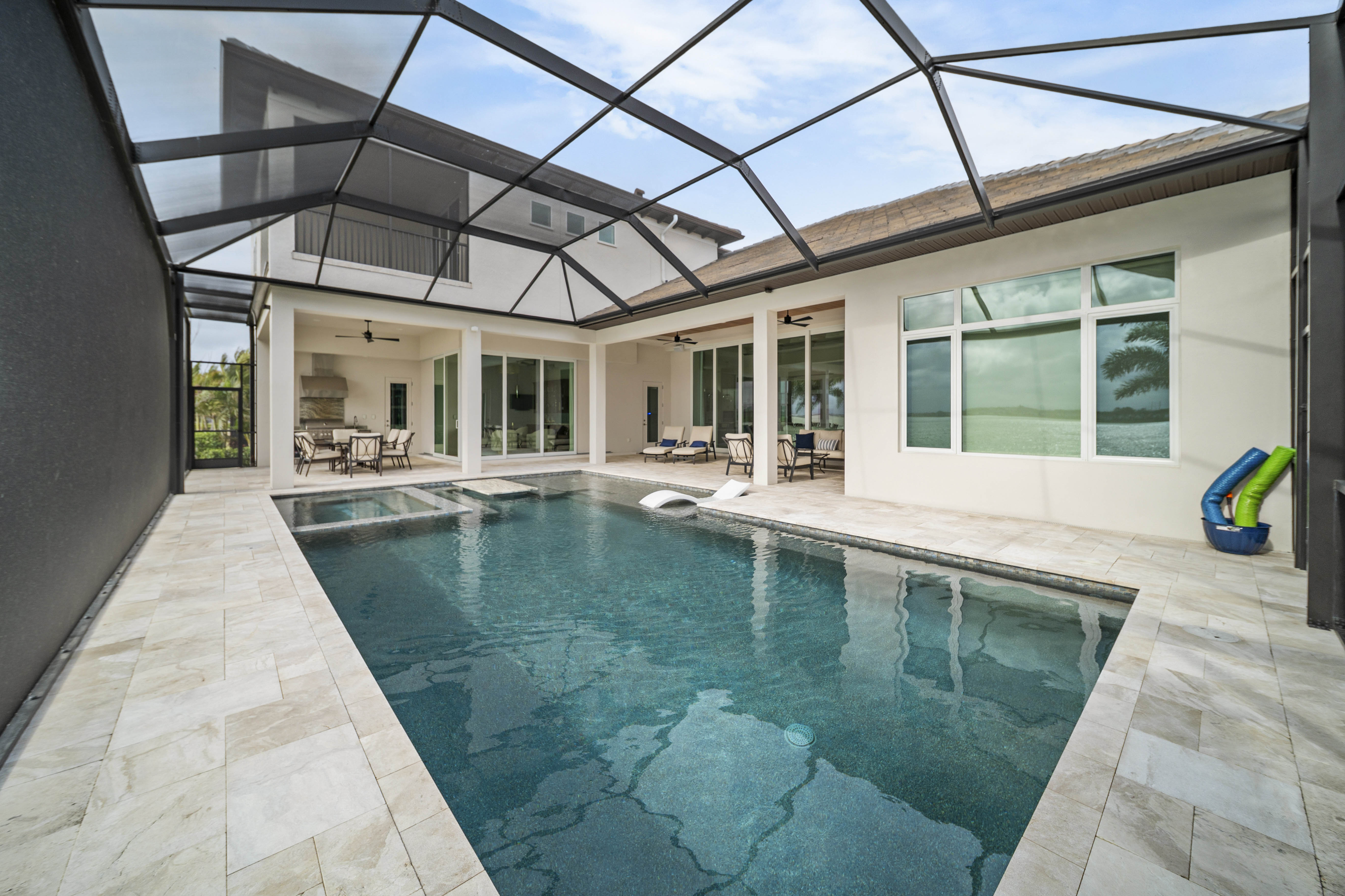 Custom pool design and construction in Osprey, FL - Swim Inc. new build with vanishing edge and architectural hardscape