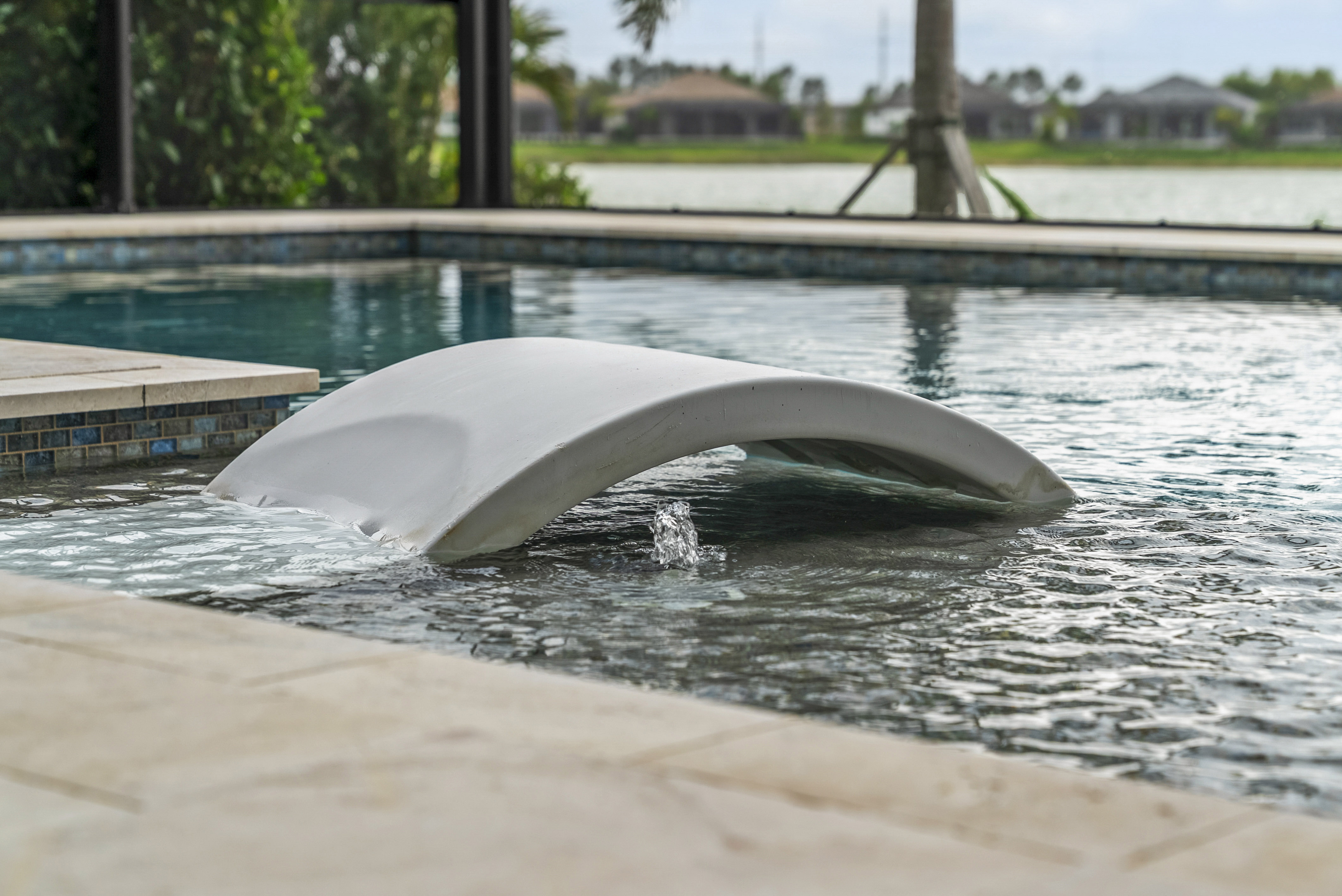Swim-up table with in-water seating in Sarasota, FL, residential pool by Swim Inc.