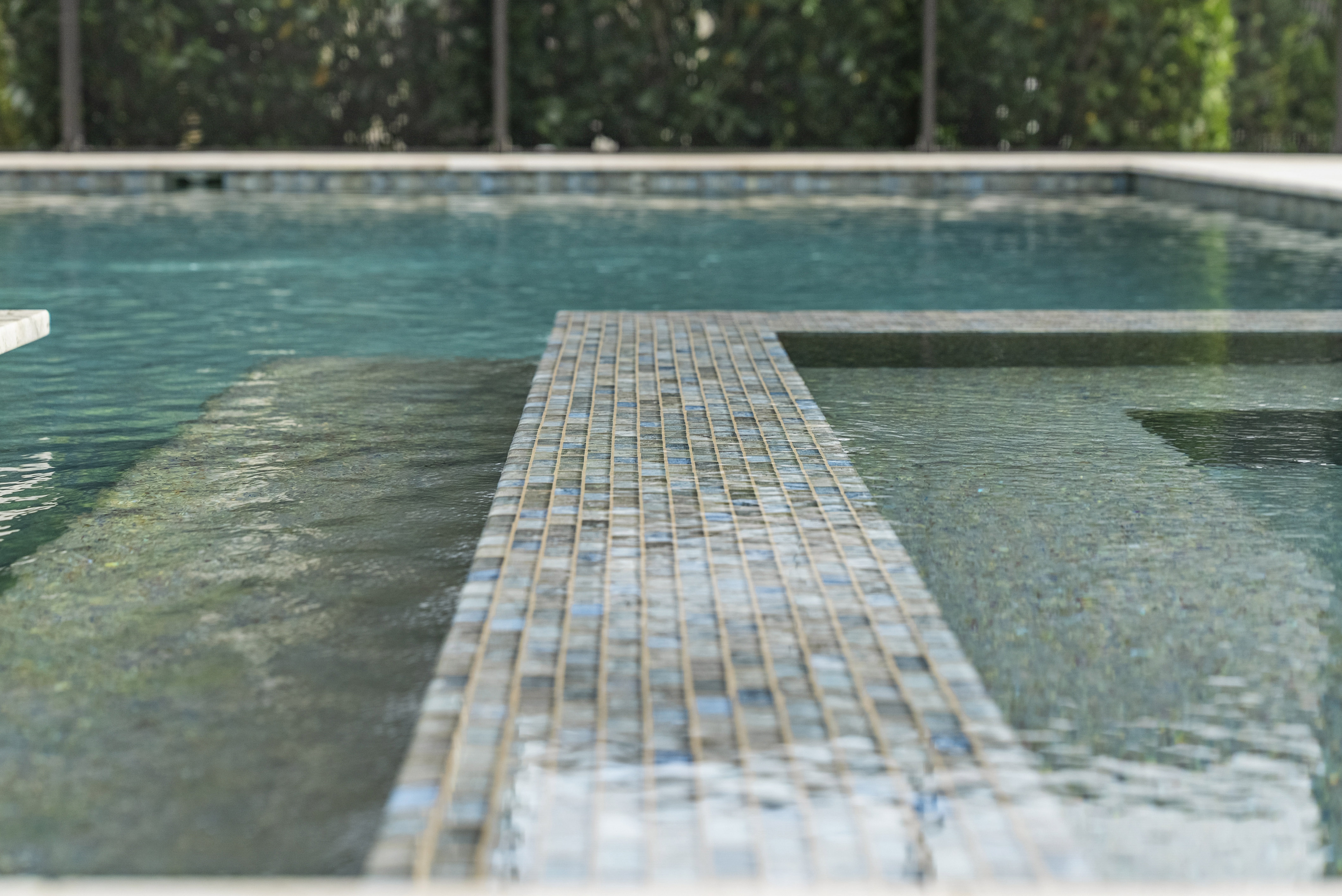LED bubblers and color-changing lighting on resort-style pool in Sarasota, FL, Swim Inc.