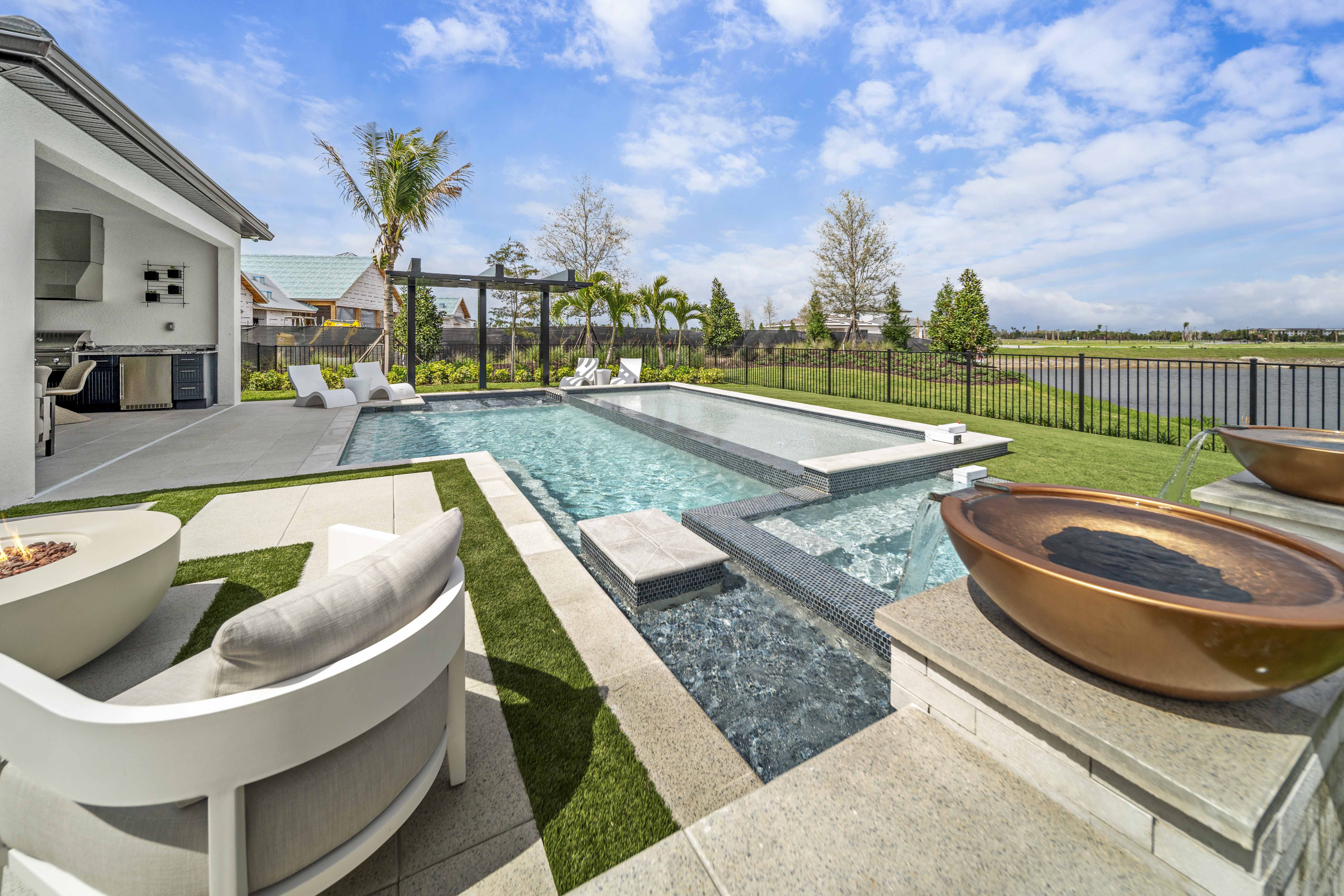 Dramatic pool remodel result, upgraded features, new deck, and transformed backyard showing full-scope renovation by Swim Inc. Sarasota