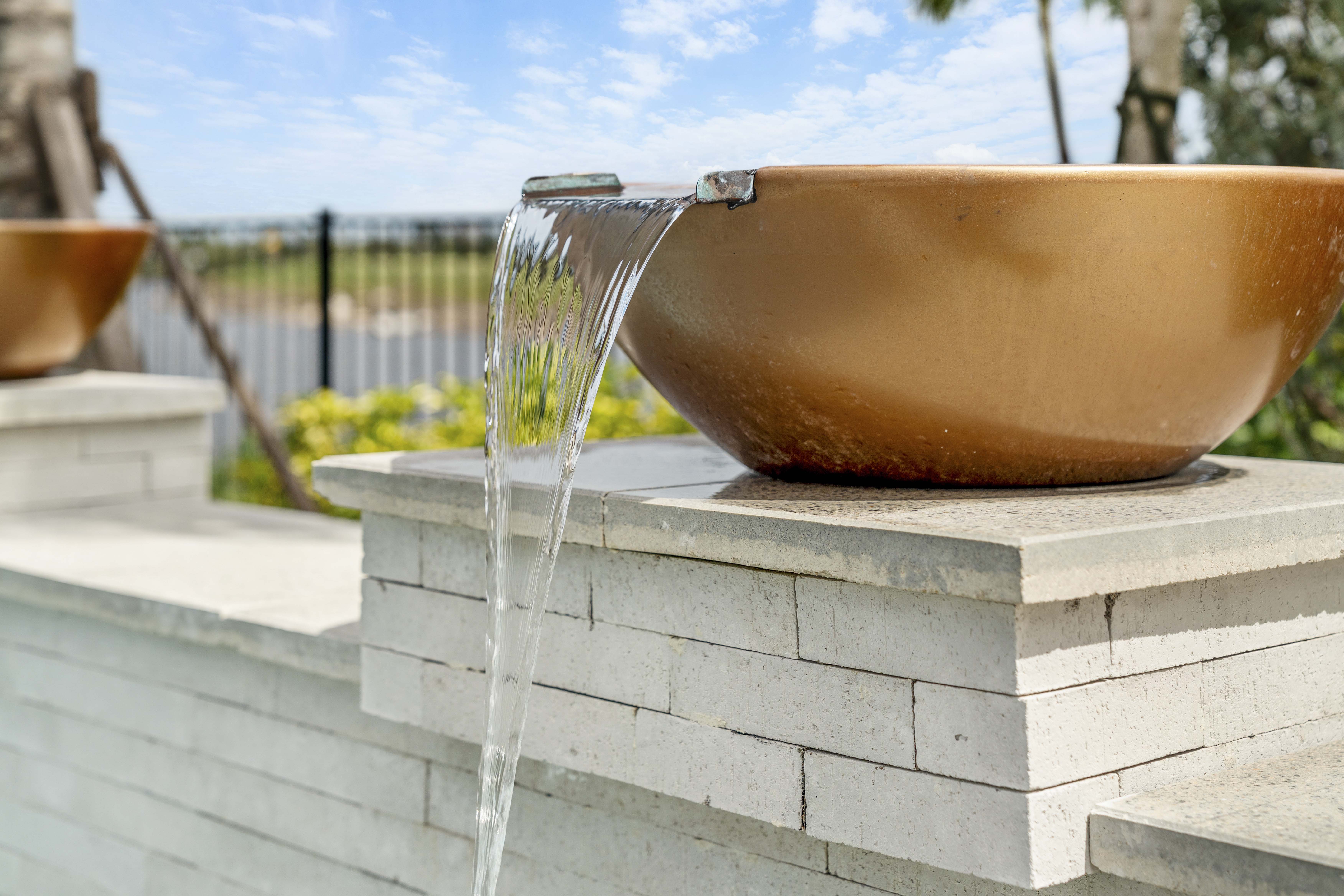 Waterfall and sheer descent water features installed on renovated pool